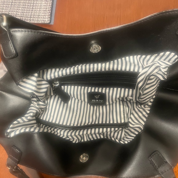 Silver toned handbag. black and white striped lining. Black straps. Waterproof. - Picture 2 of 4
